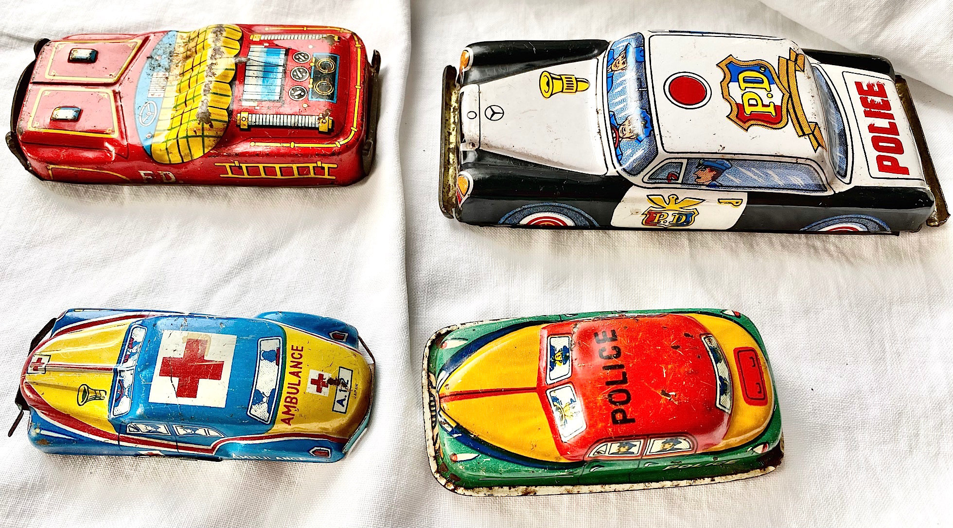 Four Tin Litho Toy Cars Made In Japan – Each One Sold