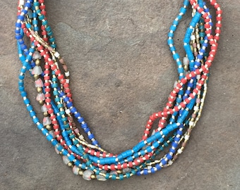 Multi-strand Necklace with Silver, Brass, Blue, Red, White and Clear Glass Beads from Ethiopia