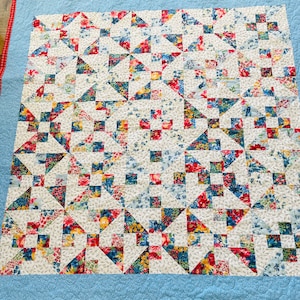 Red, Blue, and White Patchwork Quilt