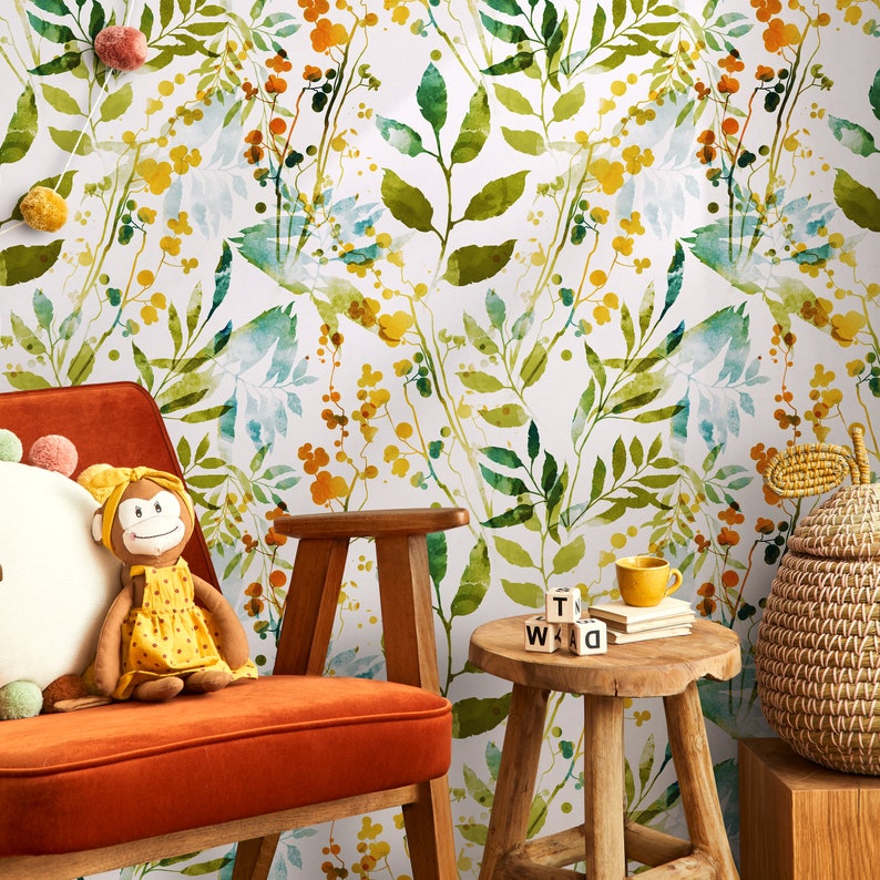 May include: A watercolor floral wallpaper with green leaves and yellow flowers. The wallpaper is in a room with a red armchair, a wooden stool, and a small toy monkey.