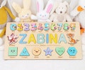 Personalized Kids Name Puzzle with Numbers, Animals, and Shapes - Custom Birthday Gift for Baby Boy or Girl - Wooden Baby Puzzle Name 94A18 product logo