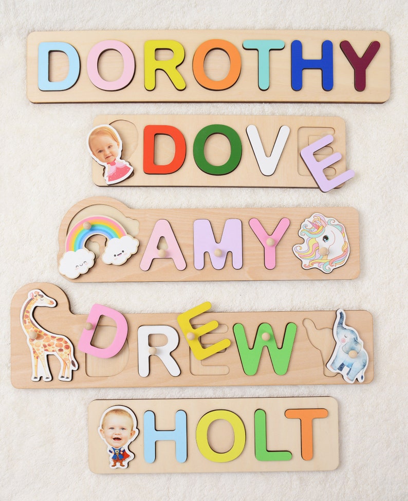 May include: Five wooden puzzle pieces with names spelled out in colorful letters. Each piece has a picture of a child and a small animal. The names are Dorothy, Dove, Amy, Drew, and Holt.