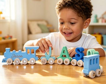 May include: A wooden toy train set featuring a light blue engine with the name Jason engraved on the side, followed by individual train cars carrying the letters J, A, S, O, and N in various shades of blue and green, all with small wheels.