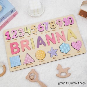 May include: Wooden puzzle with colorful numbers 1 through 10, the name Brianna, and shapes including a square, triangle, circle, star, hexagon, and heart. The puzzle pieces are designed with a floral pattern.