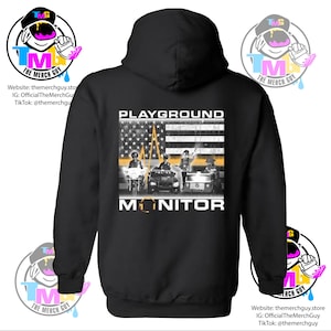 May include: Black hooded sweatshirt with a graphic print of an American flag with a heartbeat graphic and the text "PLAYGROUND MONITOR".