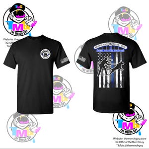 May include: Black t-shirts with a Redondo Beach Police Canine design. One shirt features a badge and American flag sleeve detail. The other displays a graphic of a police officer and dog with the text "PATROL NARCOTICS EXPLOSIVES".