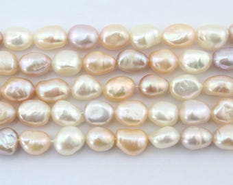 May include: A strand of baroque freshwater pearls in shades of white, pink, and lavender. The pearls are irregular in shape and have a smooth, lustrous finish.