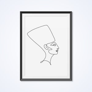 May include: Line art drawing of a woman wearing a headdress, in a black frame.