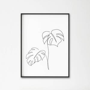 May include: A black and white line drawing of two tropical leaves in a minimalist style.