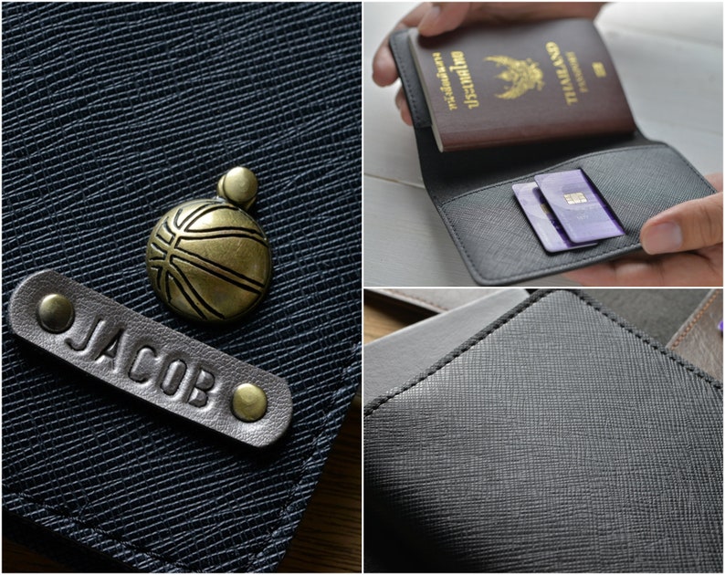 May include: A black leather wallet with a textured surface. The wallet has a personalized leather tag that reads "JACOB". A bronze basketball charm is also visible. The wallet is shown holding a passport and credit cards.