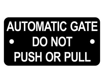 Placa con letrero de "No empujar ni tirar" para puerta automática