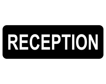May include: A black rectangular sign with white text that reads "RECEPTION".