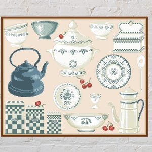 May include: A framed print featuring various kitchenware items in a vintage style. The collection includes a blue teapot, bowls, plates, a sugar container, and a soup tureen. The color palette consists of blue, white, and beige tones, with red accents.