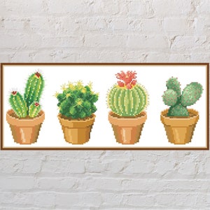 May include: Four potted cacti in different shapes and sizes. The cacti are green and have spines. The pots are brown and have a textured surface.