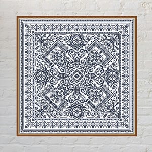 May include: A square cross-stitch embroidery piece featuring a dark blue geometric and floral pattern on a white background. The design is symmetrical, centred, and enclosed within a dark blue border, all framed by a thin brown wooden frame.