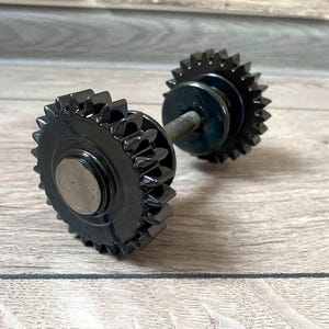 Metal Door Handles: Handcrafted. Elevate your doors with these original, painted metal door knob crafted from repurposed gears.