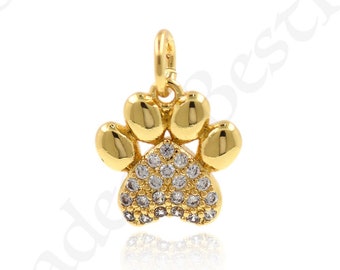 May include: Gold paw print charm with clear crystal accents. The charm is perfect for adding a touch of personality to jewellery or crafts.
