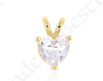 May include: A gold heart-shaped pendant with a clear cubic zirconia stone.