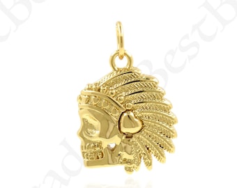 May include: Gold-tone pendant charm featuring a skull wearing a headdress with feathers. The skull has a heart-shaped detail on the side.
