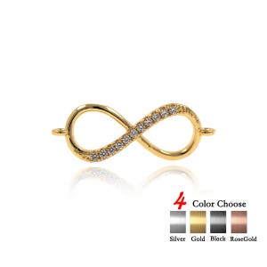 Pode incluir: Encanto de infinito dourado com pedras de zircônia cúbica transparentes. O encanto está disponível em quatro cores: prata, ouro, preto e ouro rosa.