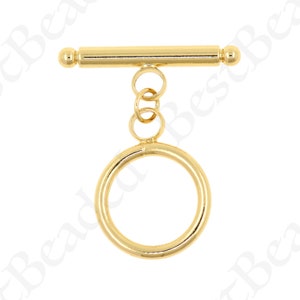 May include: Gold-toned metal toggle clasp with a round ring attached. The clasp is designed for jewellery making and crafting.