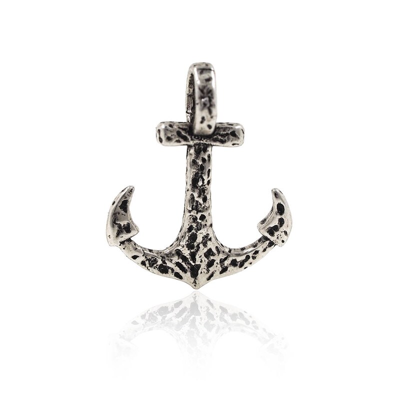 May include: A silver anchor pendant with a textured surface. The anchor has a loop at the top for attaching to a chain.