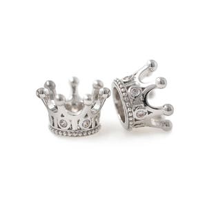 May include: Two silver crown-shaped bead charms with clear rhinestone accents.