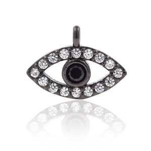 May include: Black evil eye charm with a black centre and clear crystal accents.