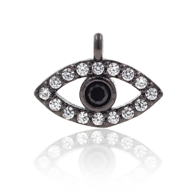 May include: Black evil eye charm with a black centre and clear crystal accents.