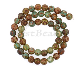 May include: Strand of round, natural-looking beads. The beads are a mix of earthy tones, including brown, green, and tan, with a cracked, textured appearance. The beads are strung together, ready for jewelry making or crafting.