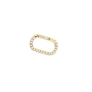 May include: A gold oval-shaped connector with a row of small clear diamonds around the edge.
