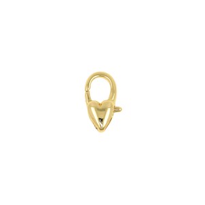 May include: A gold-colored heart-shaped clasp. The clasp has a rounded top with a hinged opening and a heart-shaped bottom. The clasp is designed to secure jewelry or other accessories.