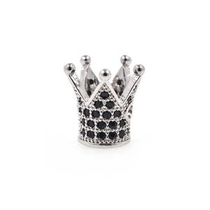 May include: A silver crown with black cubic zirconia stones. The crown is a popular design for jewelry and accessories.