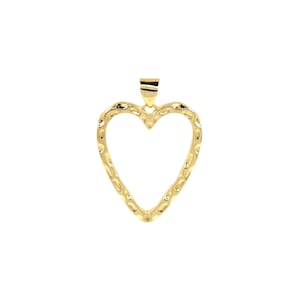May include: A gold heart-shaped pendant with a textured surface.