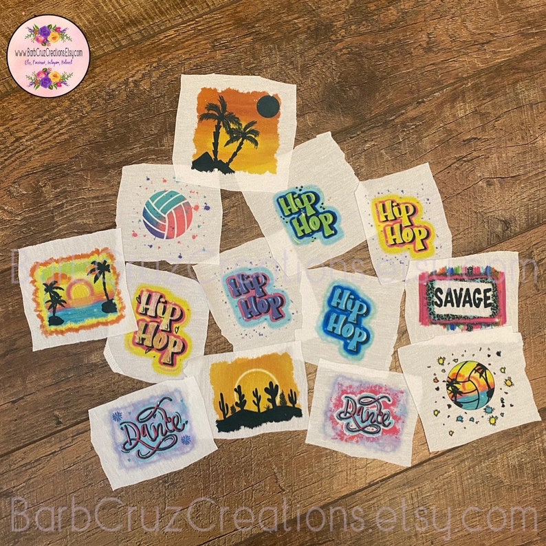 May include: Ten colourful fabric squares with various designs, including a volleyball, palm trees, a sunset, cacti, and the words "Hip Hop" and "Savage".