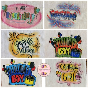 May include: Six different airbrushed designs on white t-shirts. The designs include "It's My Birthday", "Birthday Boy", "Birthday Girl", "Jesus Vibes", "Freedom", and a design with balloons and a cake.