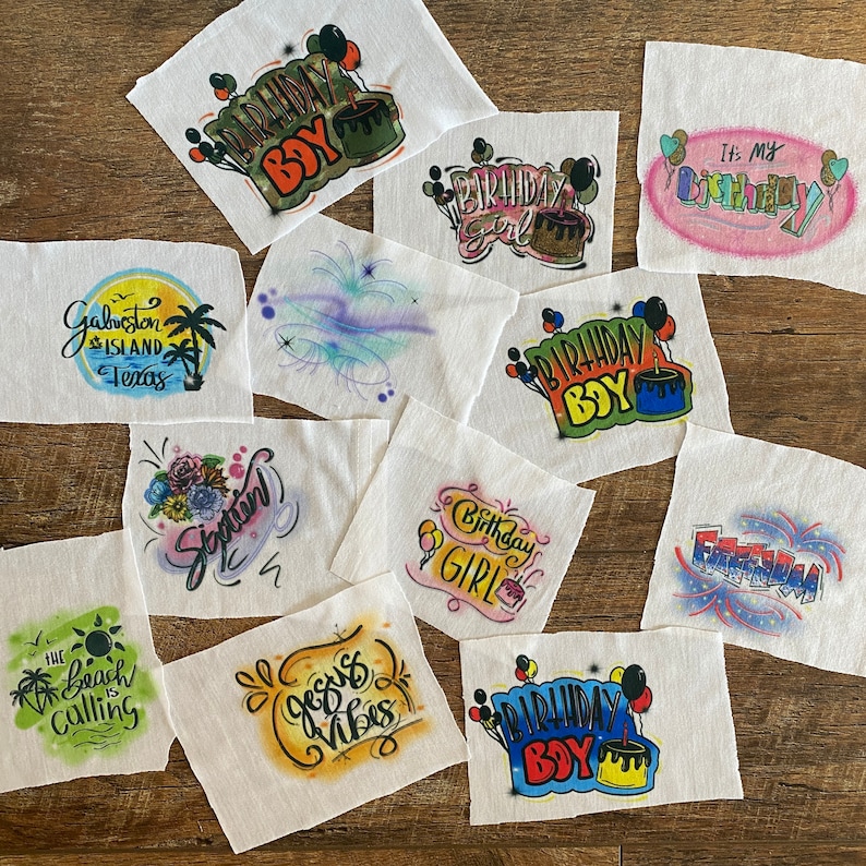 May include: Ten different iron-on transfers for t-shirts. The designs include birthday boy, birthday girl, fireworks, and a beach scene. The transfers are printed on white fabric.