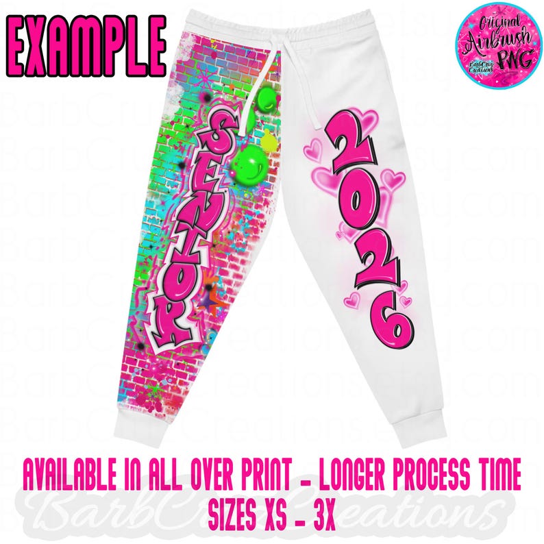 May include: White sweatpants with a drawstring waist, featuring a graffiti-style design. The left leg has the word "SENIOR" in pink, with a brick wall background. The right leg displays "2026" in pink with hearts. The word "EXAMPLE" is at the top.