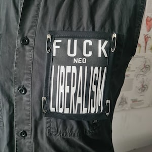 Anti neo liberalism pin on patch (organic cotton) with safety pins for wearable activism