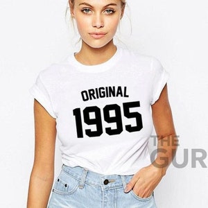 May include: White t-shirt with black text that reads "ORIGINAL 1995".