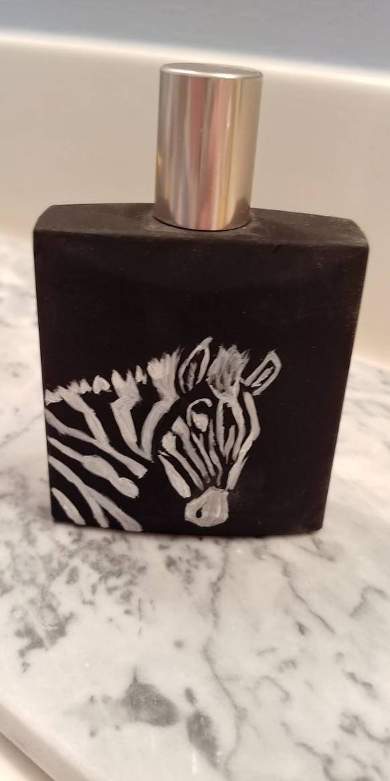 perfume with zebra on bottle