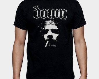May include: Black t-shirt with a white graphic of a man with a crown of thorns and the word "DOWN" above him.