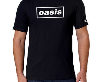 May include: Black t-shirt with a white rectangle and the word "oasis" in white letters.