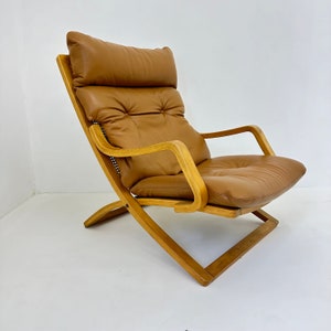 Vintage lounge chair cognac leather with webbing , 1970s