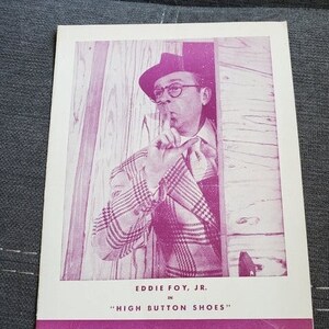 May include: A vintage pink and white playbill for a performance of "High Button Shoes" starring Eddie Foy Jr. at the Lyceum Playgoer.