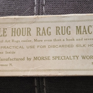 May include: A vintage box for an "Idyle Hour Rag Rug Machine". The box is white with gold lettering and states "Makes Beautiful Art Rugs easier, More even than a hook and several times as fast. A PRACTICAL USE FOR DISCARDED SILK HOSE. Full Instructions Inside. PRICE $1.00. Manufactured by MORSE SPECIALTY WORKS. 4722 Aldrich Avenue N. Minneapolis, Minn."