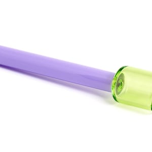 May include: A purple glass smoking pipe with a green glass bowl.