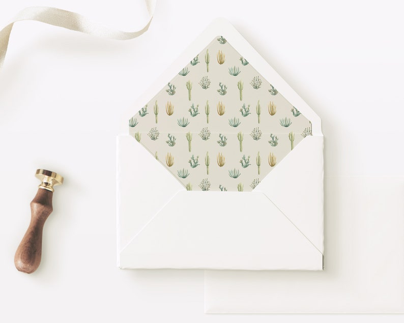 May include: A white envelope with a cactus and succulent pattern lining the inside flap. The envelope is lying open on a white surface with a wax seal next to it.