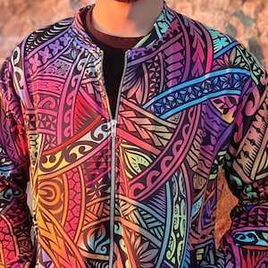 May include: A colourful bomber jacket with a Polynesian-inspired print. The jacket features a zip closure and long sleeves.