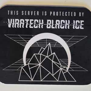 May include: Black and white sticker with the text "This server is protected by - VIRATECH BLACK ICE -" and a graphic of a mountain with a crescent moon behind it.